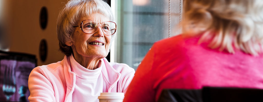 Holding elderly person’s hand in Wrexham